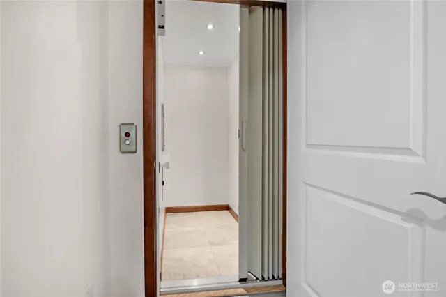 a bathroom with a shower sink and mirror