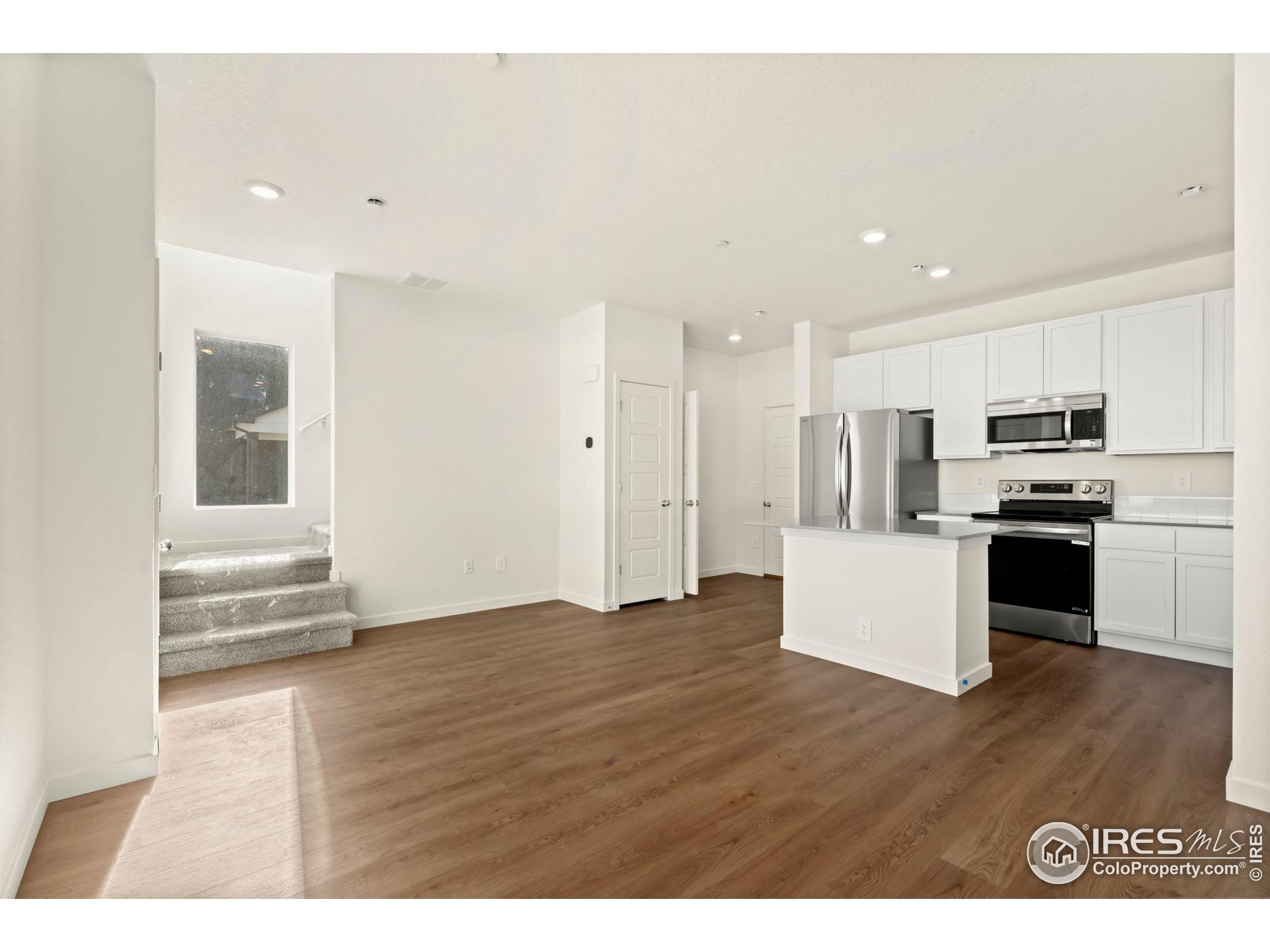 3904 Net Street Evans, CO 80620 - Photo 2 of 14 a view of kitchen with wooden floor