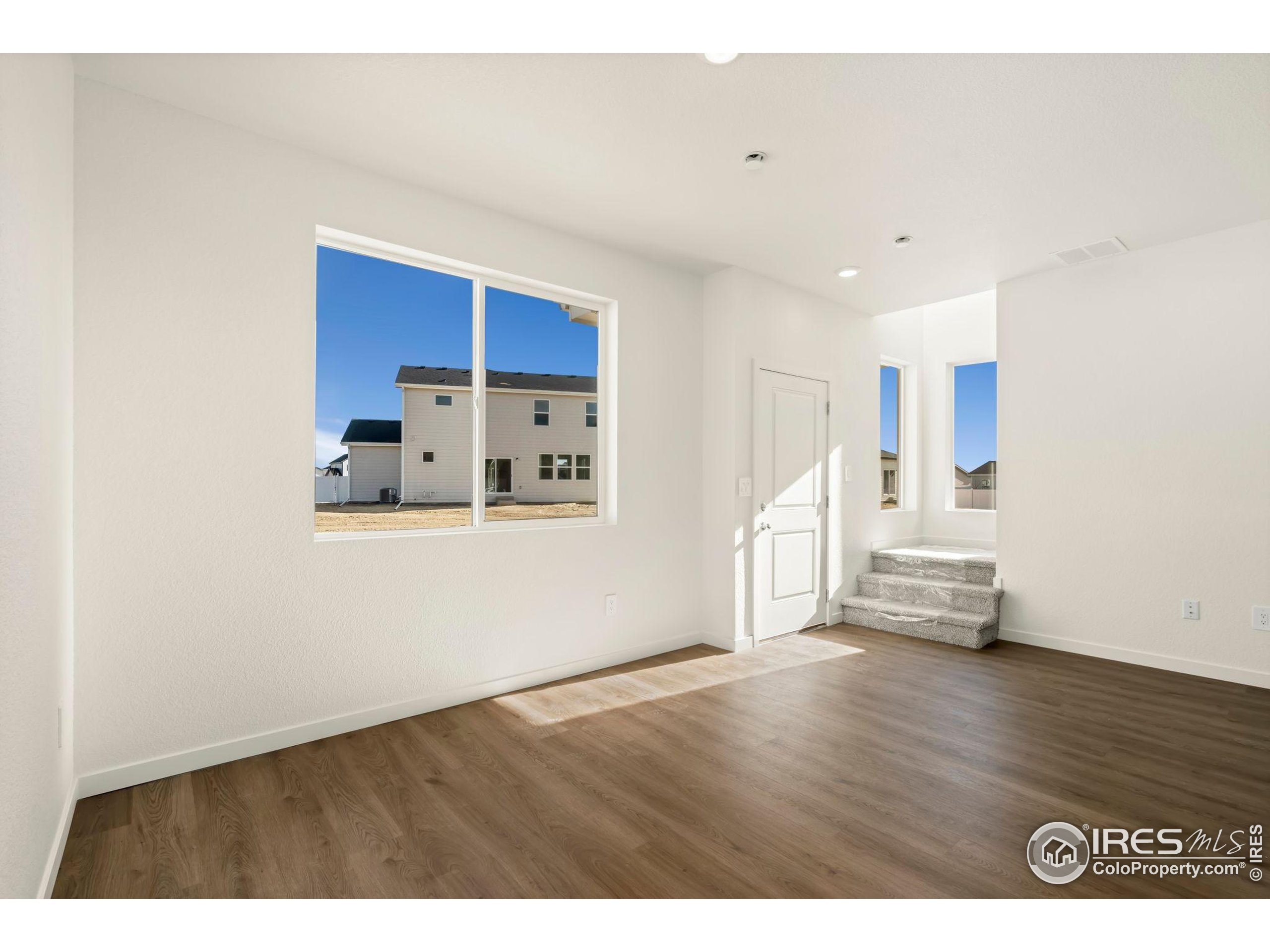 3904 Net Street Evans, CO 80620 - Photo 3 of 14 a view of empty room with wooden floor