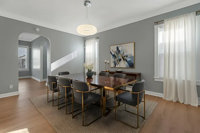 a view of a dining room with furniture and wooden floor