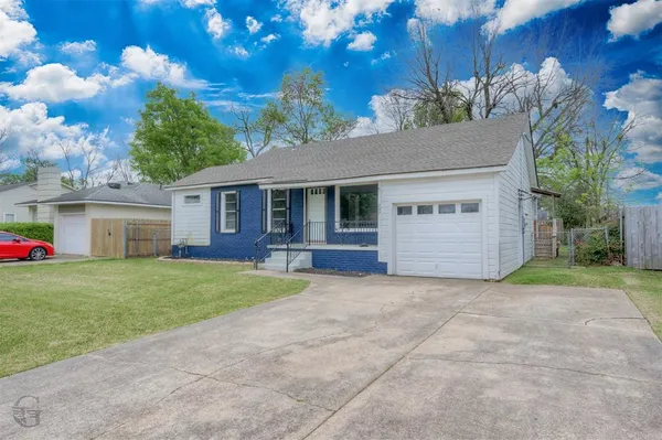 a view of a house with a back yard