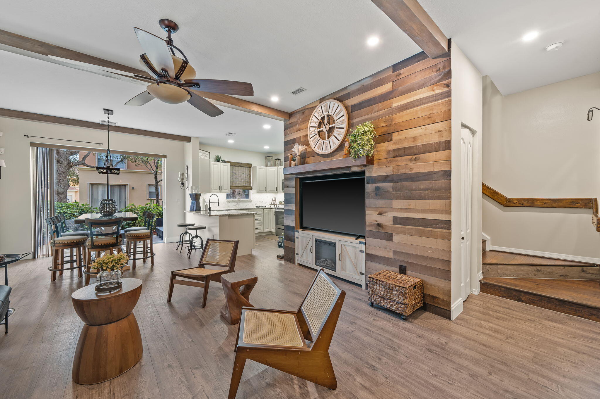 a view of a livingroom with furniture and a flat screen tv