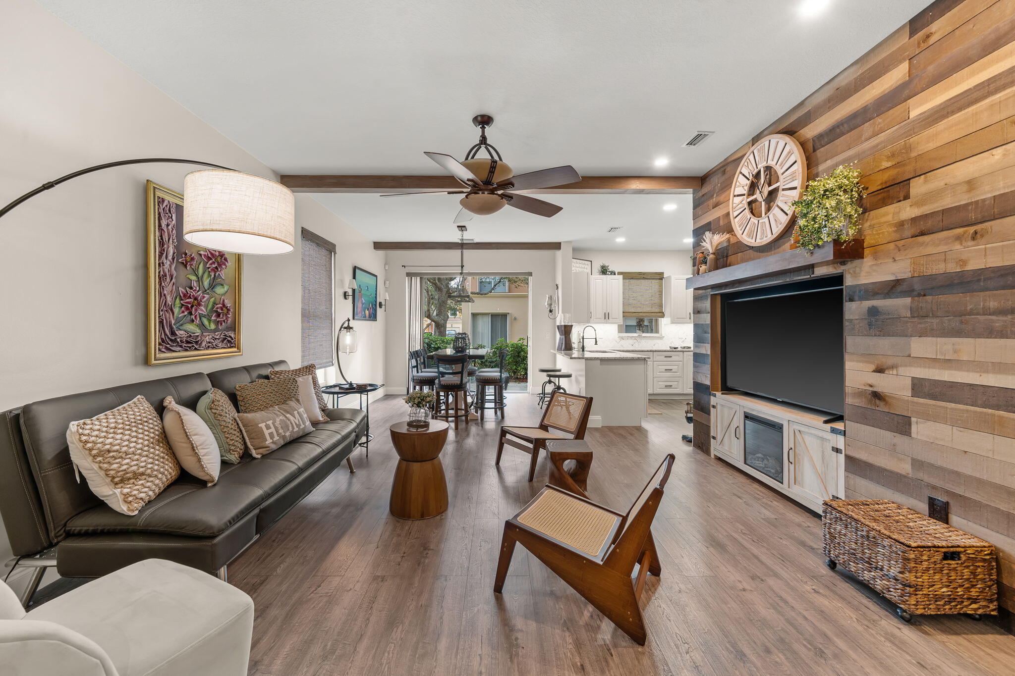 123 Wakulla Springs Way Royal Palm Beach, FL 33411 - Photo 11 of 27 a living room with furniture a fireplace and a flat screen tv