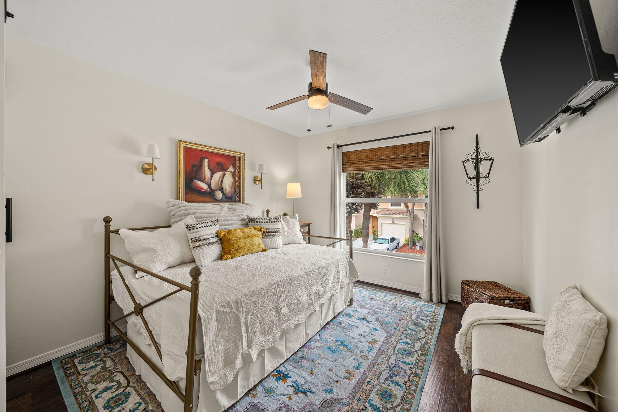 123 Wakulla Springs Way Royal Palm Beach, FL 33411 - Photo 18 of 27 a bedroom with a bed and wooden floor