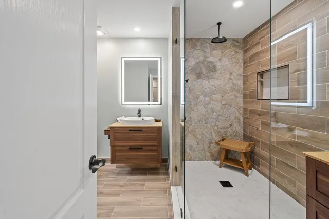 a bathroom with a shower and a sink