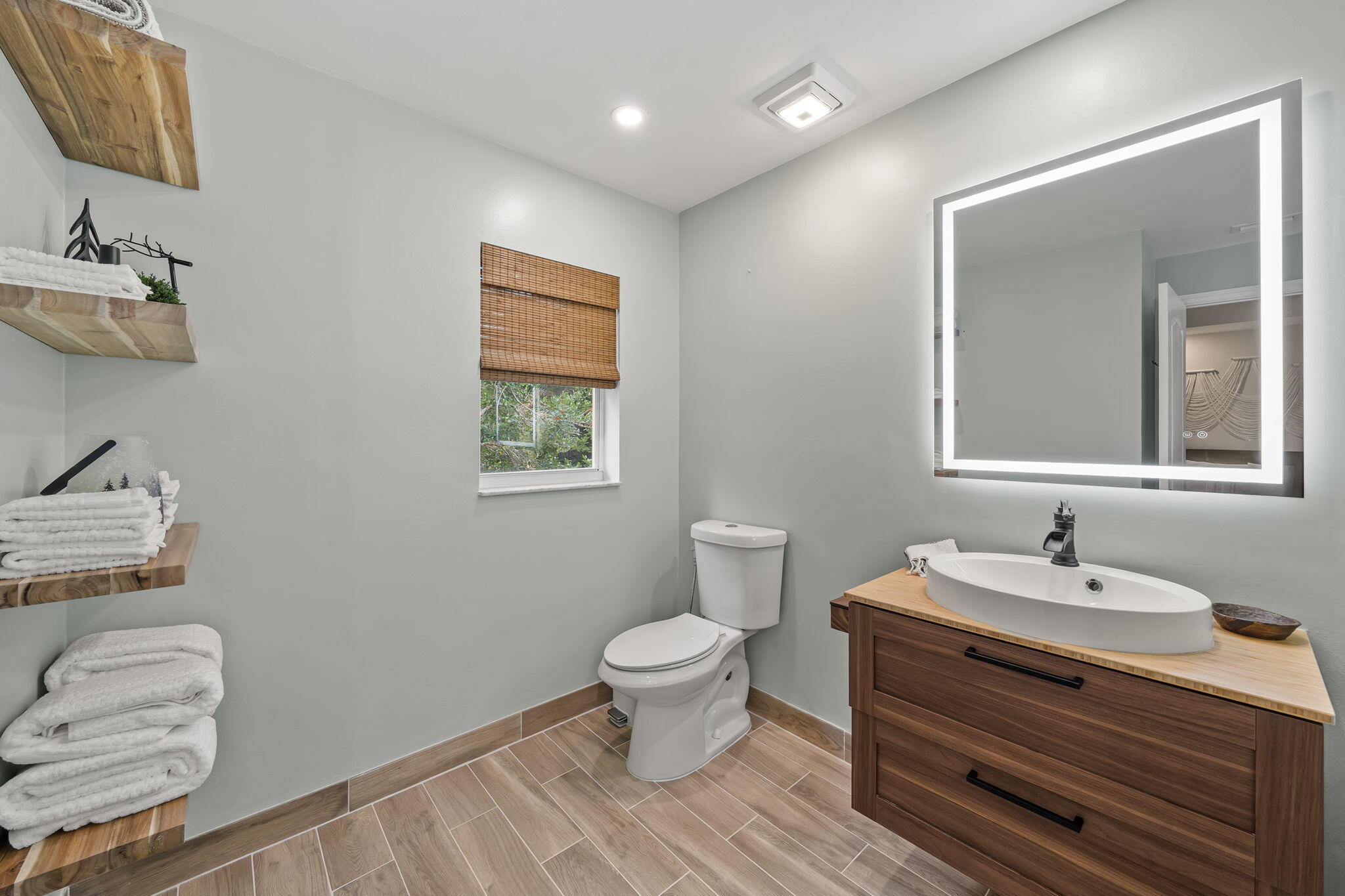 123 Wakulla Springs Way Royal Palm Beach, FL 33411 - Photo 26 of 27 a bathroom with a toilet sink and mirror