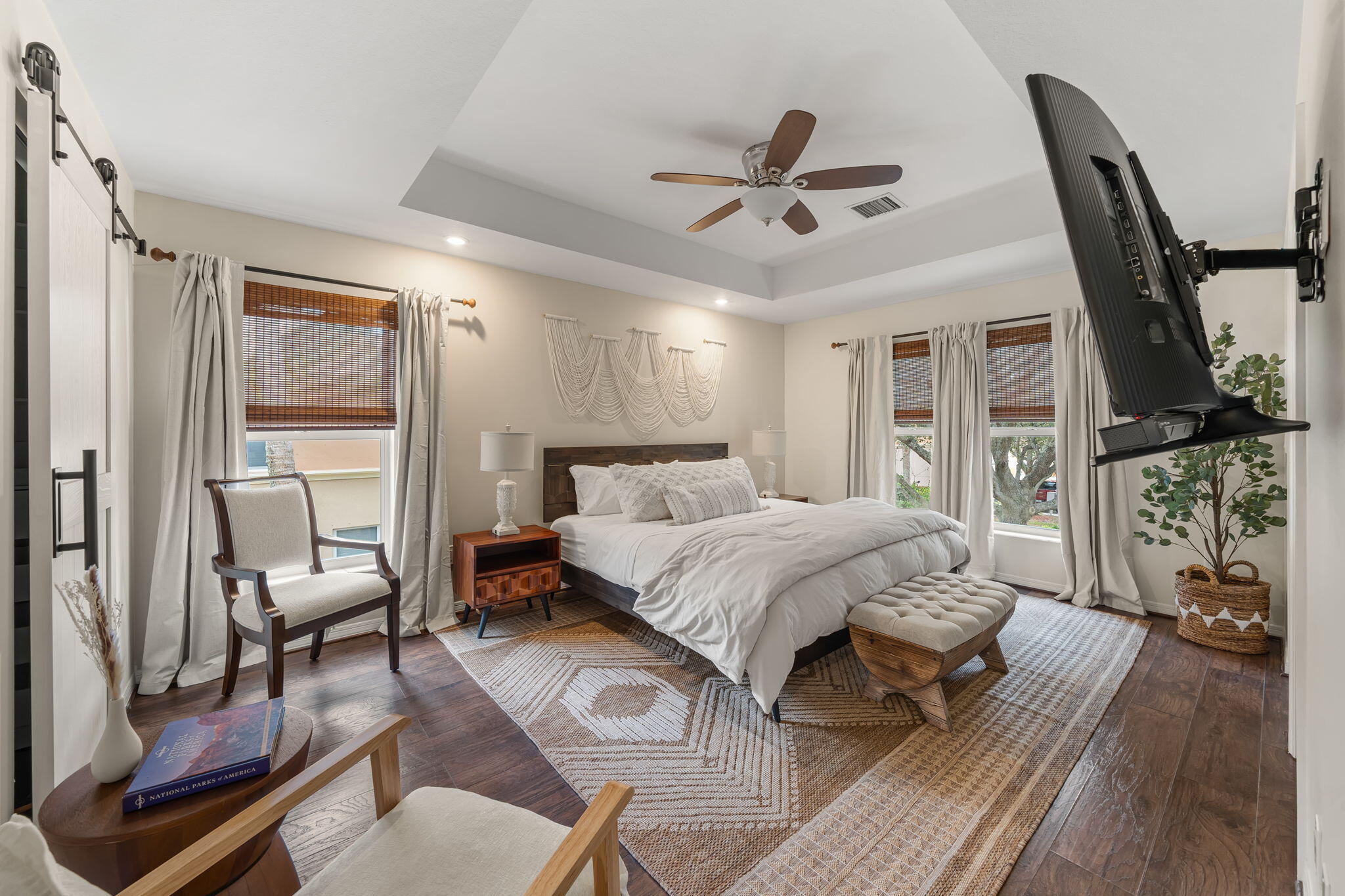 123 Wakulla Springs Way Royal Palm Beach, FL 33411 - Photo 27 of 27 a spacious bedroom with a bed a couch and a window