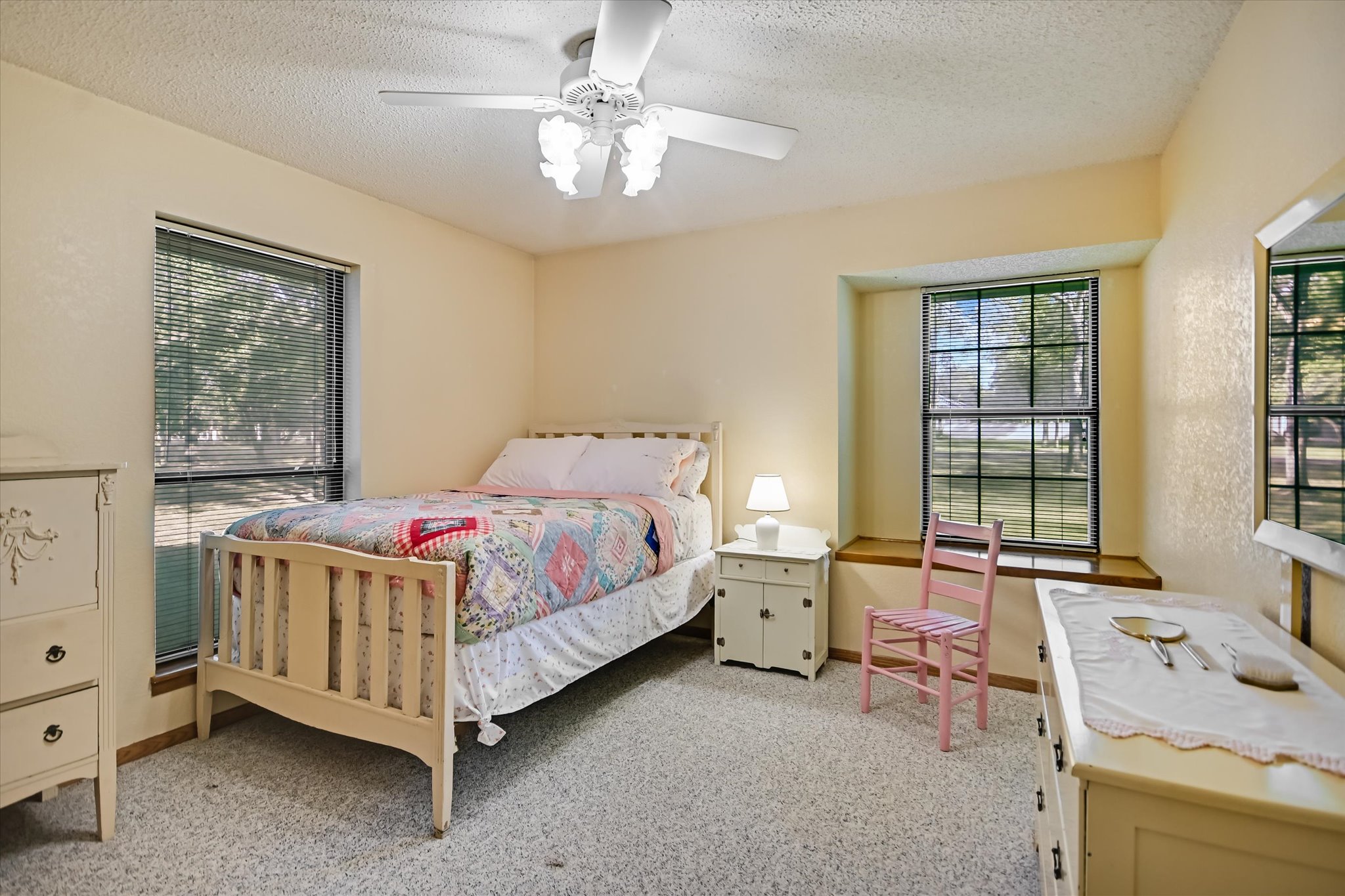 2901 Post River Road Cedar Park, TX 78613 - Photo 15 of 23 Bedroom 2 is surrounded by windows for beautiful property views.