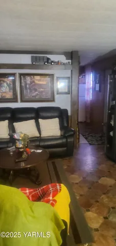 a view of a patio with table and chairs with wooden floor