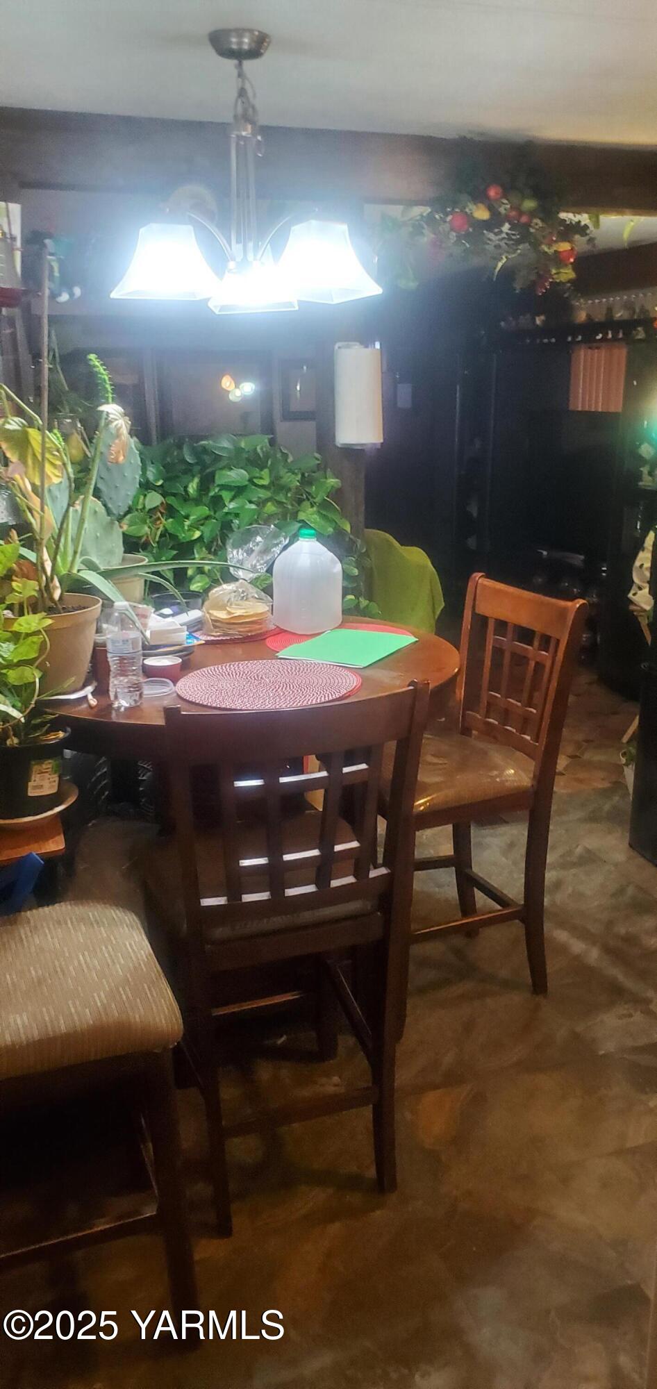 400 West 5th Street, Unit 73 Grandview, WA 98930 - Photo 6 of 6 a view of a patio with table and chairs with wooden floor