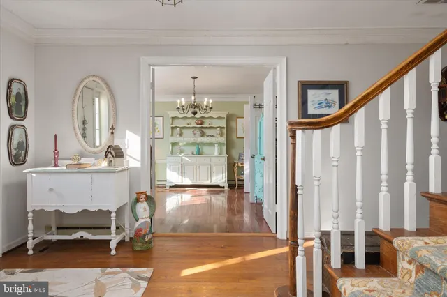 a view of hall way with seating area