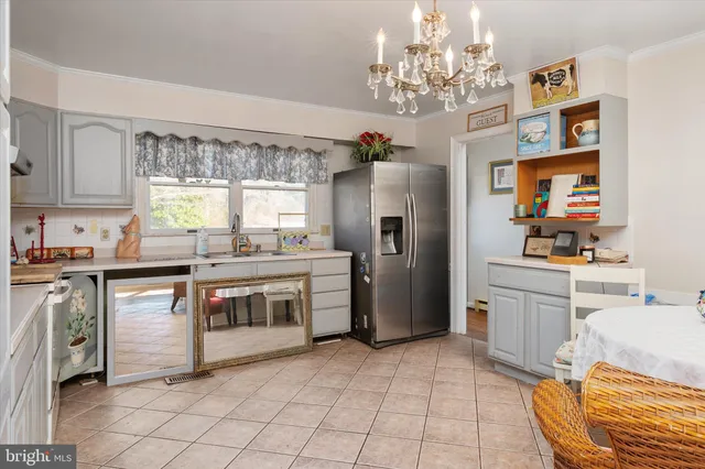a kitchen with cabinets and window
