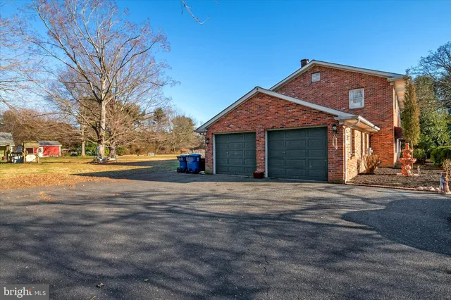a view of road with card parked on side and road