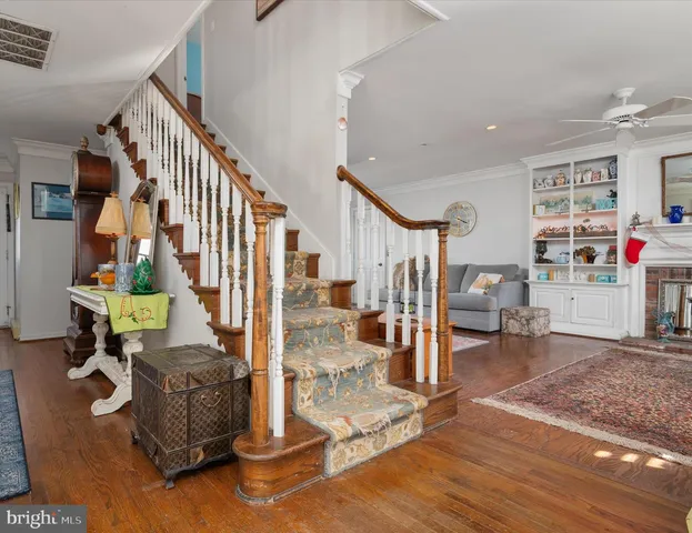 a view of entryway wih livingroom and stairs