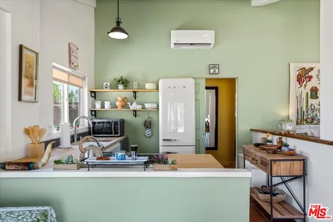 a room with furniture a washer and dryer