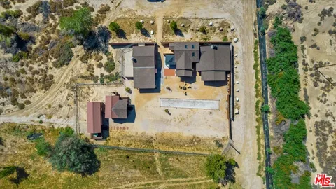 aerial view of a house with a yard