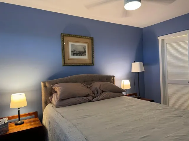 a bathroom with a sink toilet vanity and shower