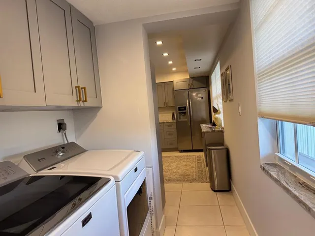 a bedroom with furniture and a flat screen tv