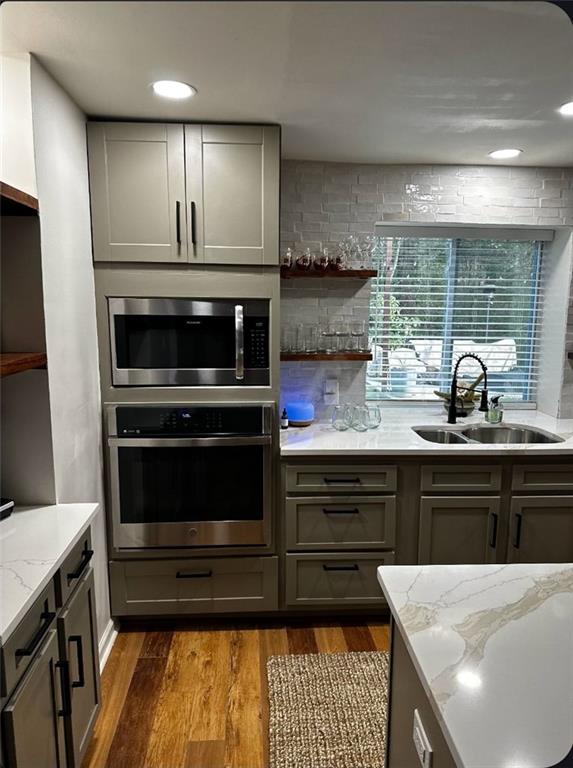 2434 Rockcliff Road Southeast Atlanta, GA 30316 - Photo 17 of 26 a kitchen with a stove and a sink