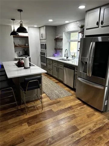 a kitchen with a sink and cabinets
