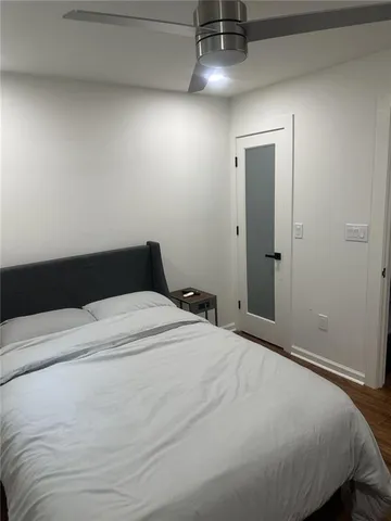 a bathroom with a shower and a toilet