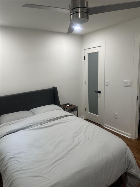 2434 Rockcliff Road Southeast Atlanta, GA 30316 - Photo 21 of 26 a bedroom with a bed and a ceiling fan