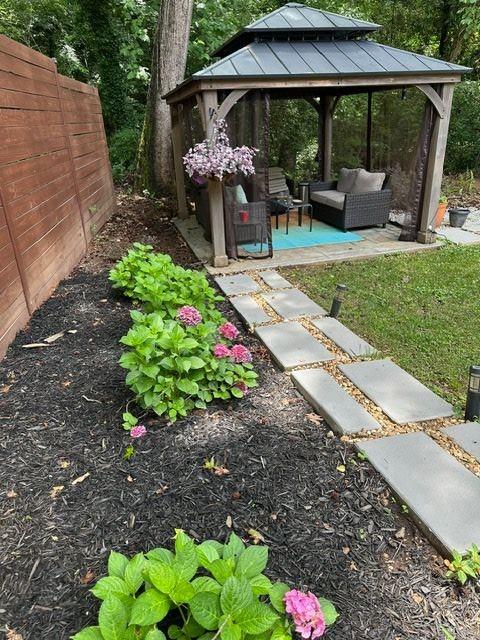 2434 Rockcliff Road Southeast Atlanta, GA 30316 - Photo 26 of 26 a view of a patio with table and chairs under an umbrella