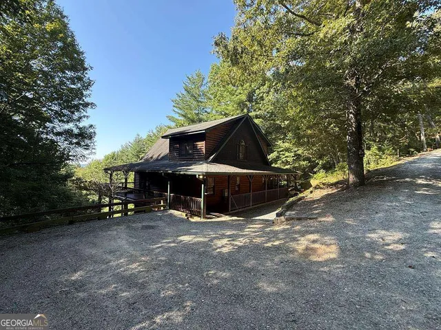 a view of a house with a snow in the yard