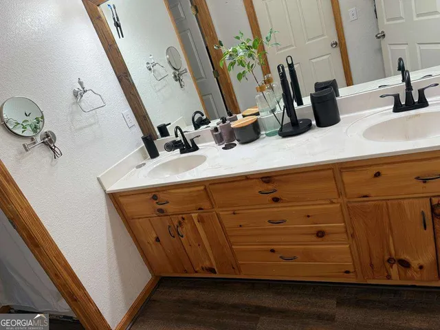 a bathroom with a sink and mirror