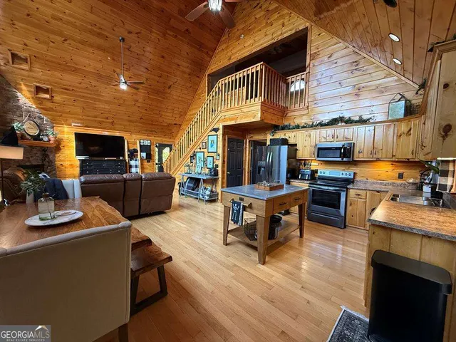 a view of a patio with dining table and chairs