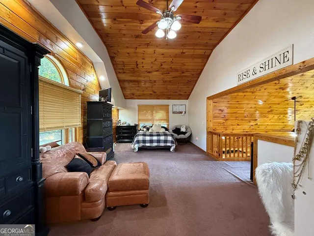 a bedroom with bed and window