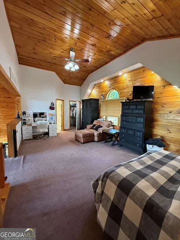 a view of a glass door with a yard from a window