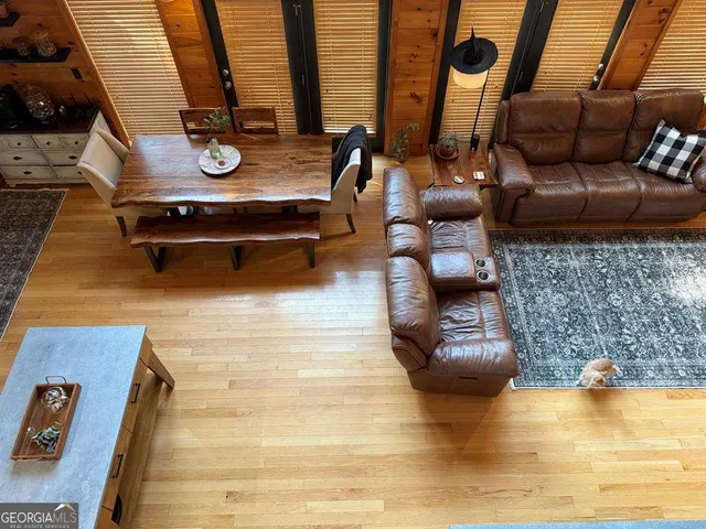 a living room with furniture and a rug