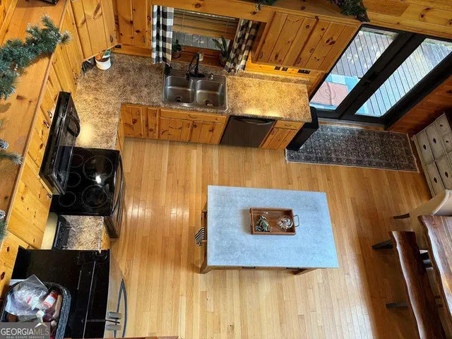 a living room with furniture a chandelier and a flat screen tv