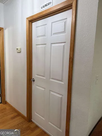 a bedroom with a bed and flat screen tv