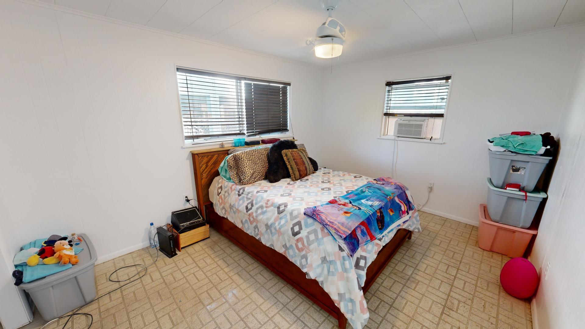 59 Tarpon Avenue Key Largo, FL 33037 - Photo 12 of 24 a bedroom with a bed and a window