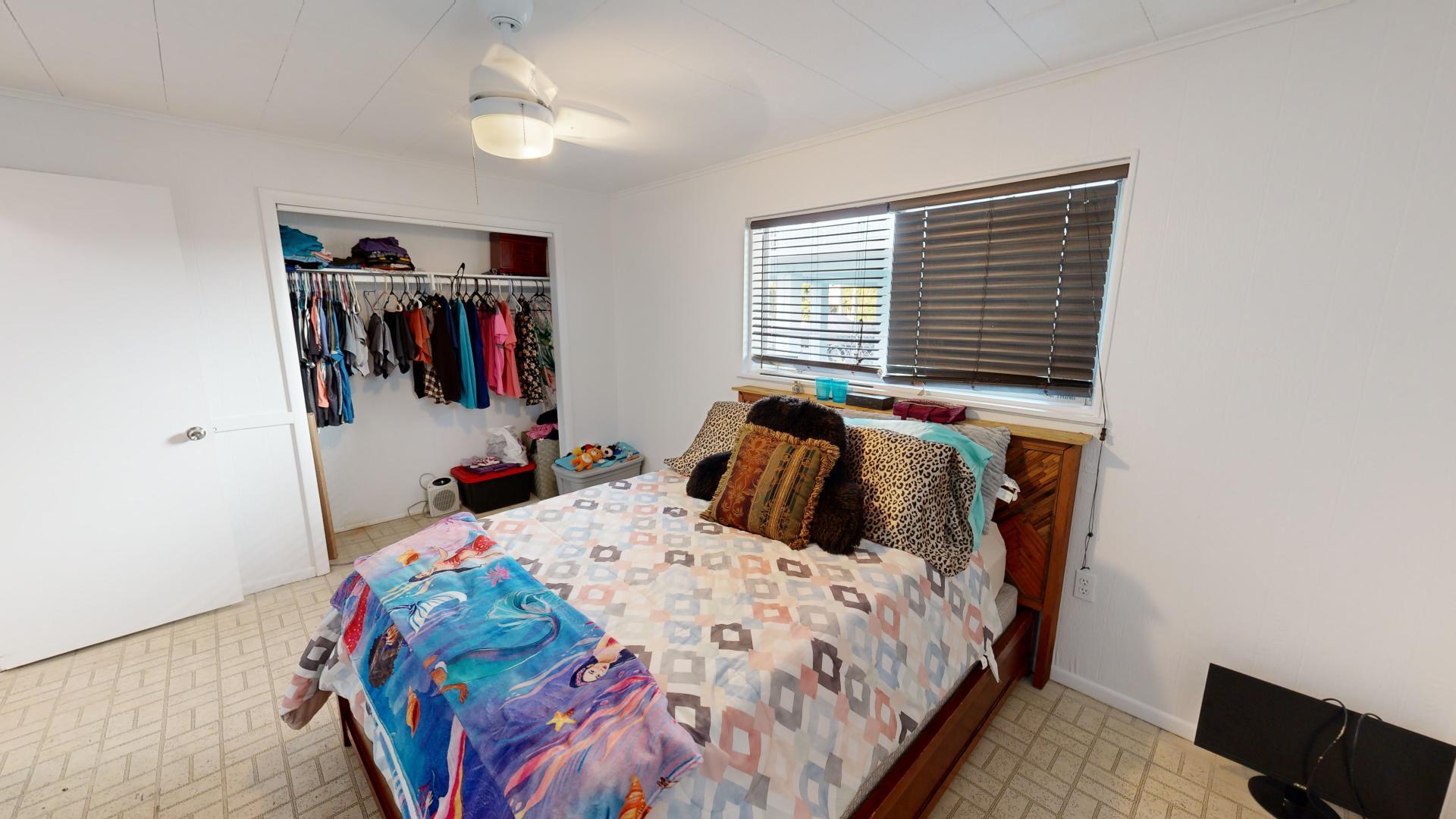 59 Tarpon Avenue Key Largo, FL 33037 - Photo 13 of 24 a bed room with a bed and a window