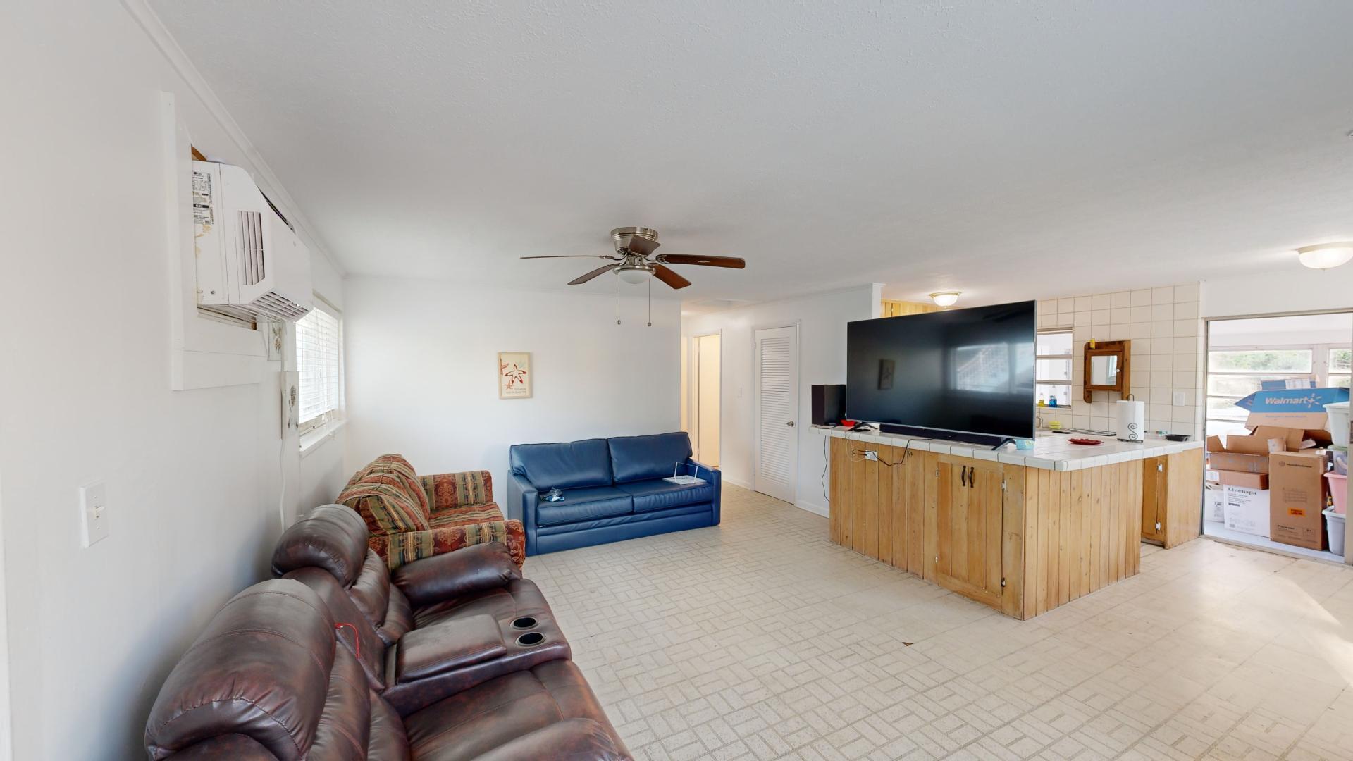 59 Tarpon Avenue Key Largo, FL 33037 - Photo 5 of 24 a living room with furniture and a flat screen tv