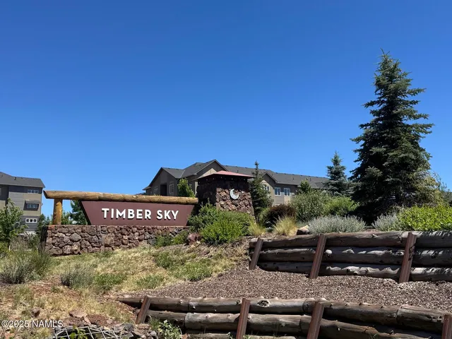 a view of a bench in front of a house