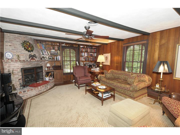 1415 Kyneton Road Villanova, PA 19085 - Photo 14 of 25 a living room with furniture fireplace and flat screen tv