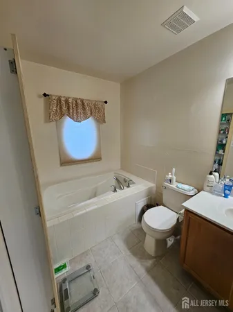 a bedroom with bed and window