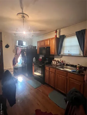 a kitchen with granite countertop a stove and a sink