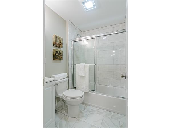 4 Leicester Street, Unit 4 Boston, MA 02135 - Photo 6 of 12 a bathroom with a toilet and a shower