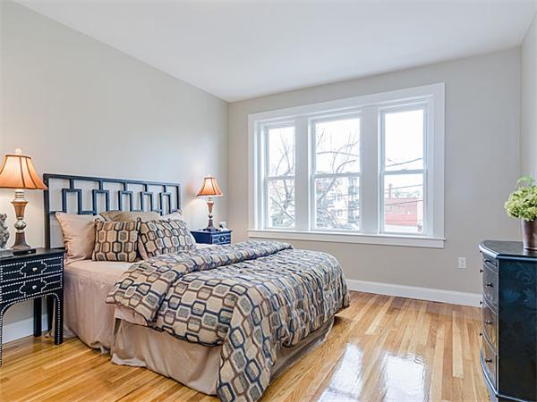 4 Leicester Street, Unit 4 Boston, MA 02135 - Photo 8 of 12 a bedroom with a large bed and a window