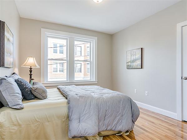 4 Leicester Street, Unit 4 Boston, MA 02135 - Photo 9 of 12 a bedroom with a bed and a window