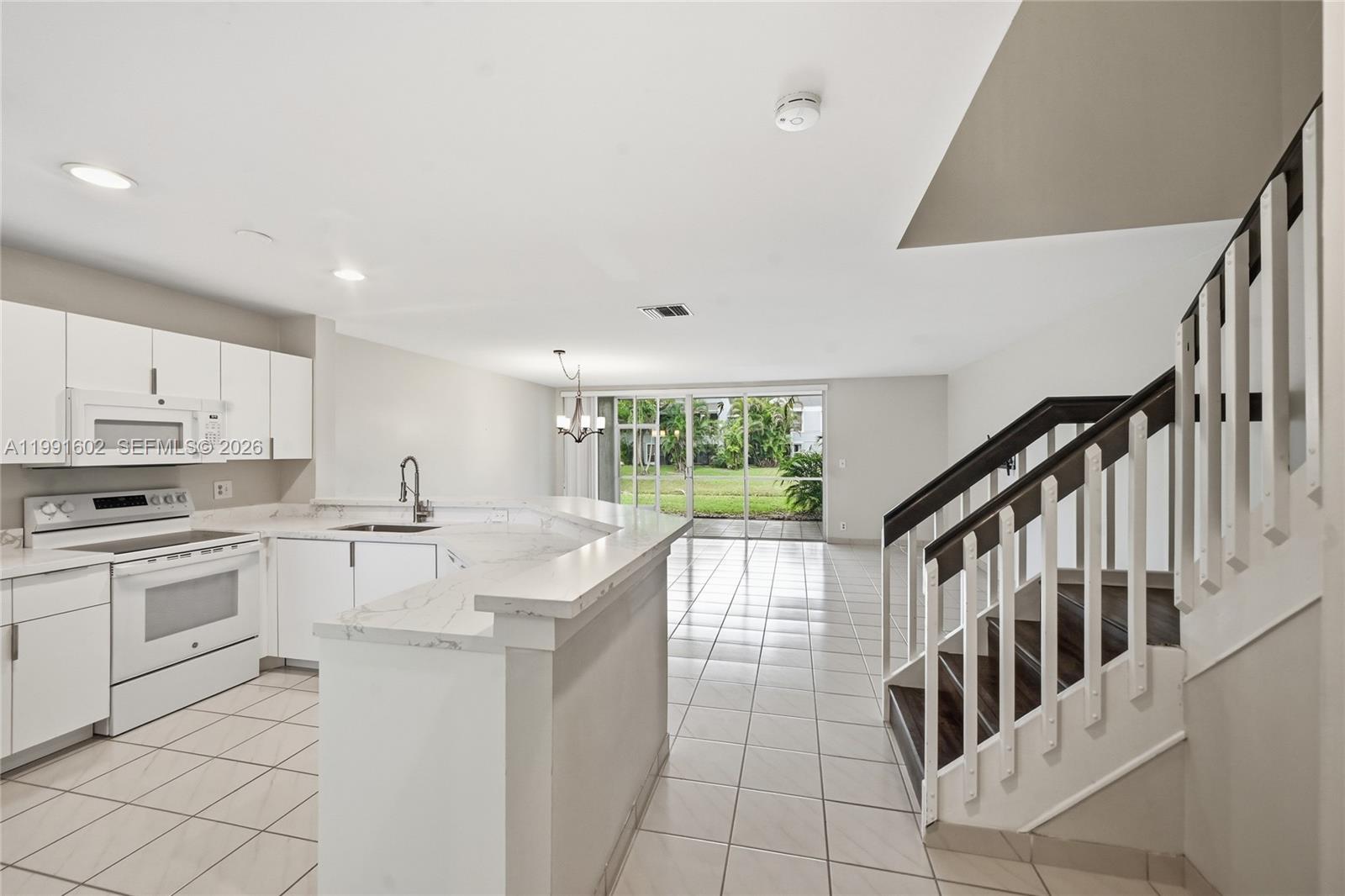 6215 Old Court Road, Unit 505 Boca Raton, FL 33433 - Photo 5 of 36 a kitchen with counter top space and appliances