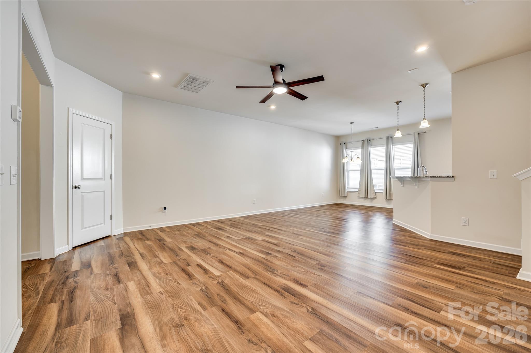 524 Hunters Dance Road Fort Mill, SC 29708 - Photo 20 of 34 a view of empty room with wooden floor and fan