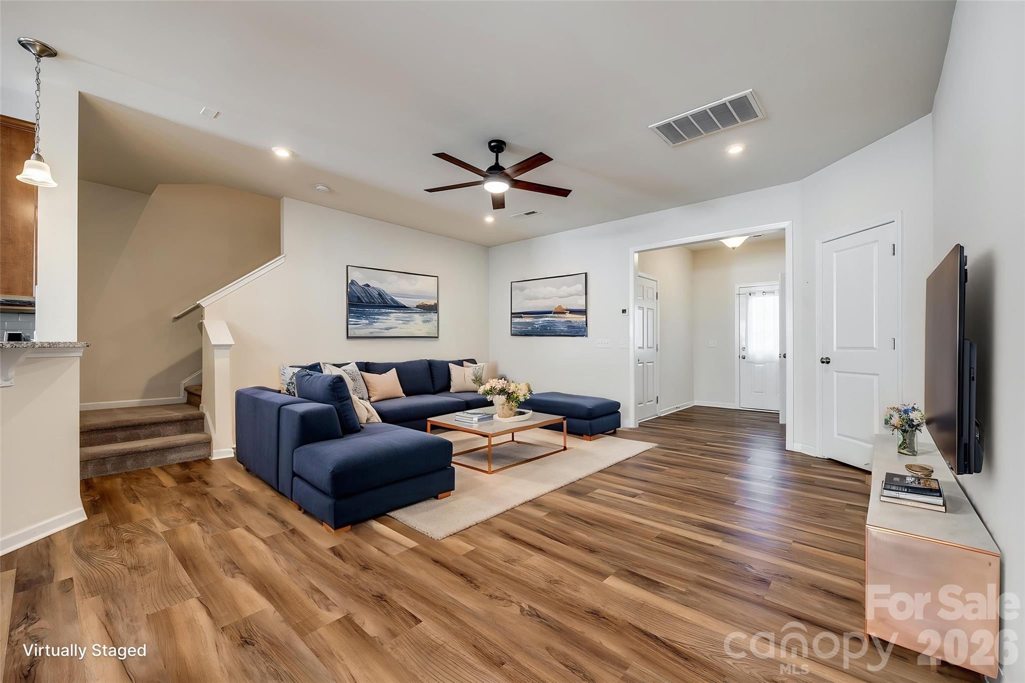 524 Hunters Dance Road Fort Mill, SC 29708 - Photo 2 of 34 a living room with furniture and a flat screen tv