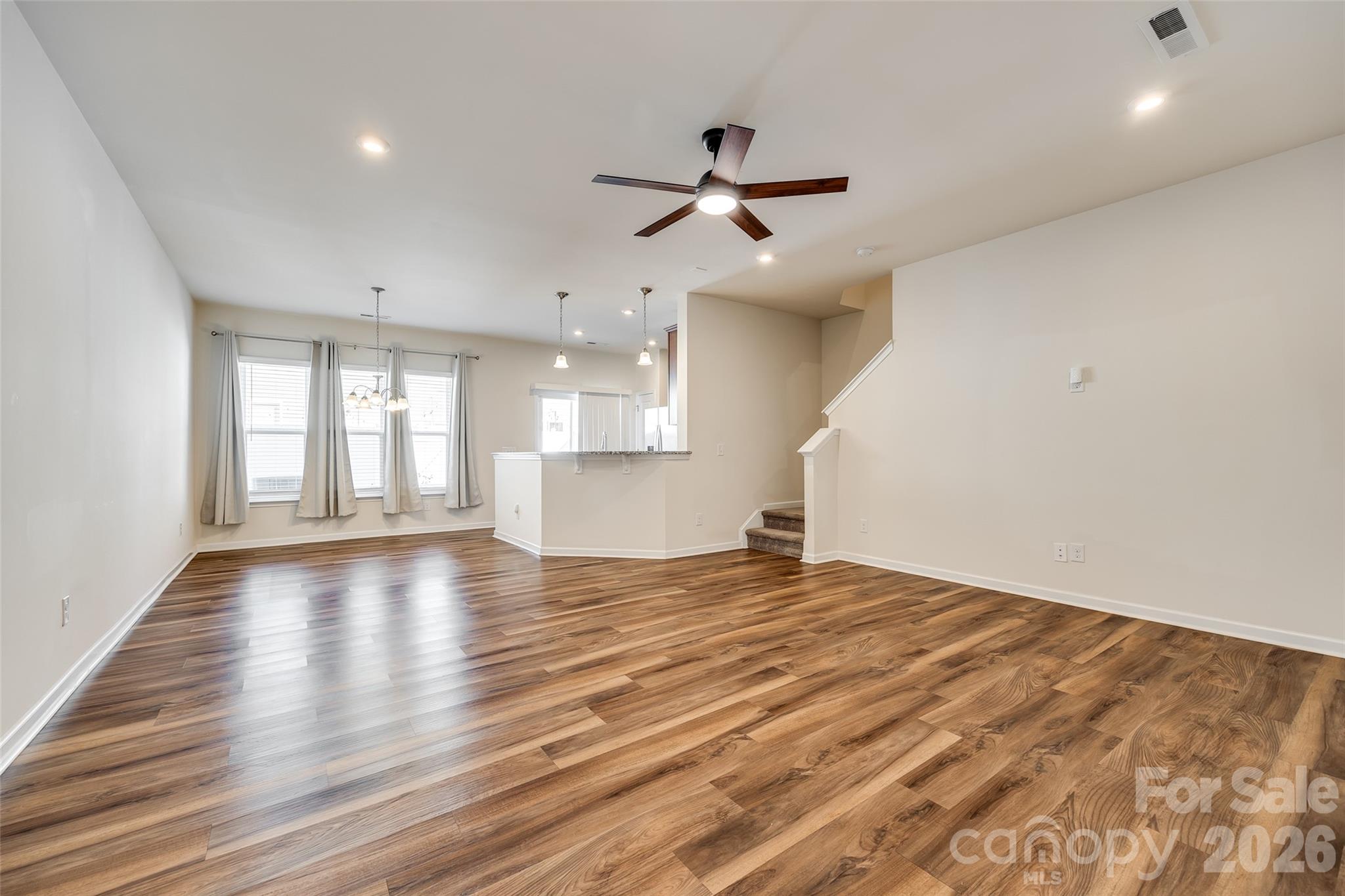 524 Hunters Dance Road Fort Mill, SC 29708 - Photo 21 of 34 a view of empty room with wooden floor and window