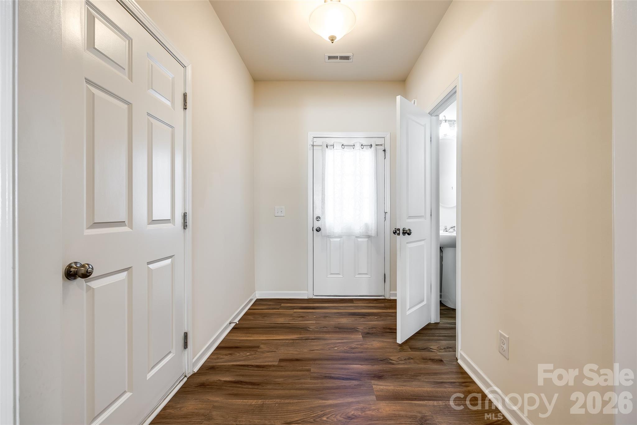 524 Hunters Dance Road Fort Mill, SC 29708 - Photo 22 of 34 a view of a hallway with wooden floor and closet